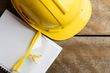 Safety equipment on wooden background