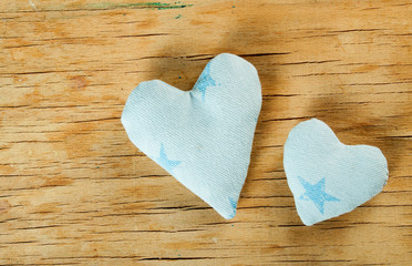 Fototapeta premium Heart from cloth on wood desk