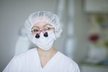 Portrait of a woman dentist in uniform