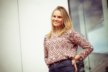 Girl posing in fashionable clothes