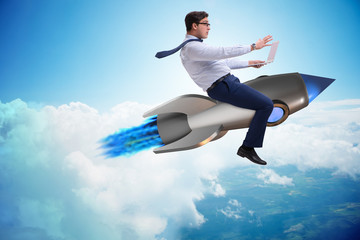 Businessman flying on rocket in business concept