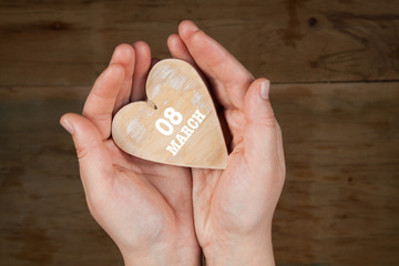 Heart from cloth on wood desk