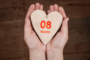 Obraz premium Heart from cloth on wood desk