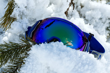 Colorful ski mask on white snow.