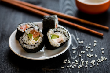 sushi meal on dark table