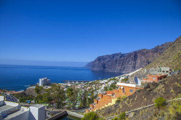 view from the hill to the house and the sea