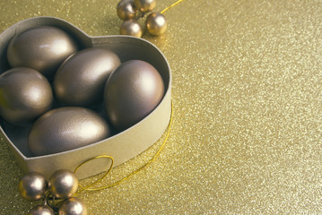 gold eggs in heart shape