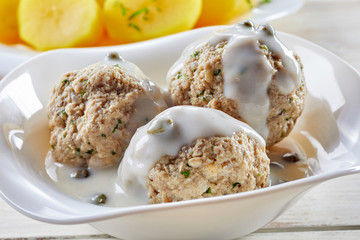 Close up view of German meatball dish in sauce