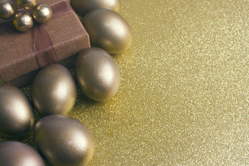gold eggs with gift