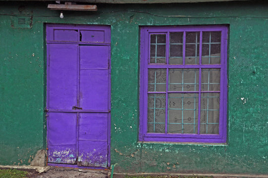 Violet door and window and matte white bulb. Village Bush Yampolsky region Vinnytsia region, Ukraine