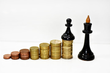 Abstract composition of chess and money.