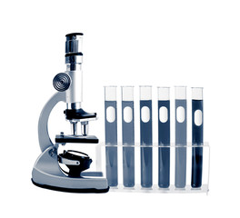 Medical test tubes with blood in holder and microscope on white background