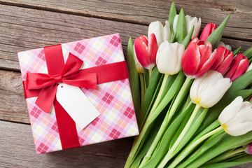 Colorful tulips bouquet and gift box