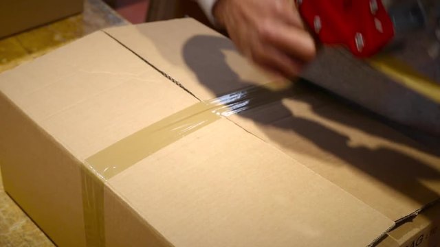 Worker prepare package box for shipment