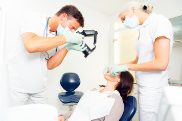Dentist Taking A Photo Of His Patient's Teeth