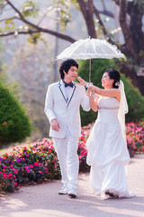 Asian Bride and Groom on Natural Background