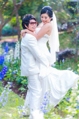 Asian Bride and Groom on Natural Background