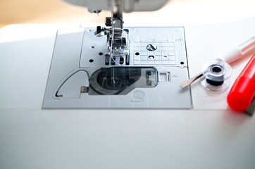 Sewing machine, spool, tool