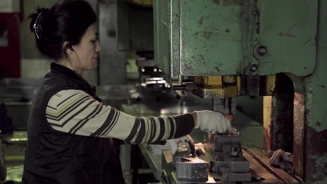 Hard work woman worker in a factory
