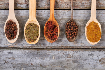 Spices on wooden background.