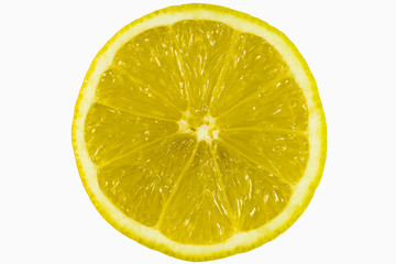 a cross-section of a half of a ripe yellow lemon exposed inside the fruit enlarged into the entire frame on a white background zoom on full frame