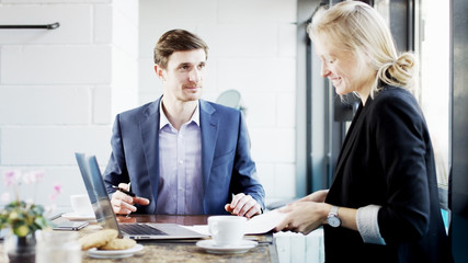 Businesswoman Gives Documents to Sign and Smiles