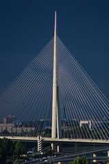 Fototapeta na wymiar Cable bridge against dark blue sky in Belgrade, Serbia