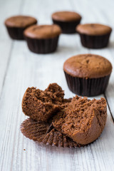 Chocolate cupcakes. Cupcakes. Cupcakes with berries,fruit,strawberries. Top view.colorful cupcake,tasty cake,colorful cream,cupcakes with summer berries on wooden background,close up,dessert concept