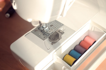 Sewing machine and thread in a box
