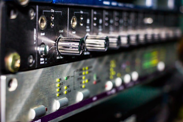 Recording studio gears in rack close up. Selective focus