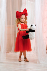 Cute girl in puppet look body paint. Young lady acts as a doll.