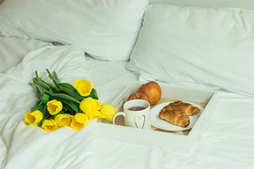 Fototapeta na wymiar Breakfast in bed. Romantic breakfast. Spring morning. Cozy.