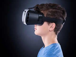 Teen boy in VR glasses