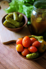 Homemade pickles. Tomatoes and cucumbers pickles from the bottle.