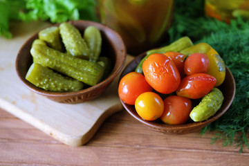 Homemade pickles. Tomatoes and cucumbers pickles from the bottle.