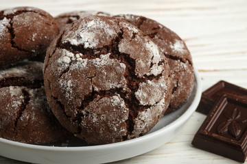 Homemade chocolate cookies with cracks. Biscuits with icing sugar.  Selective focus
