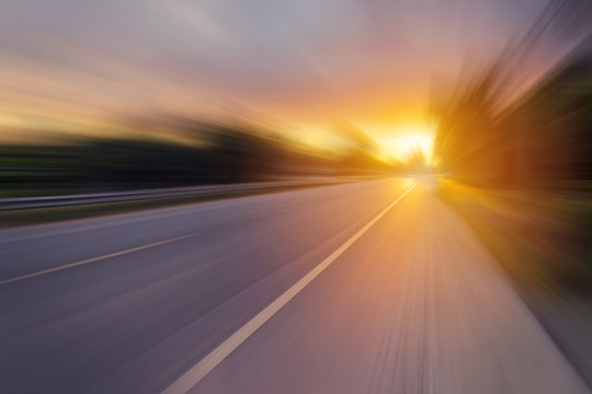 Abstract motion blur of the road and sunset
