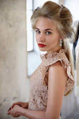 Beautiful model blond, blue eyes, red lipstick