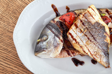 Fried fish on a white plate