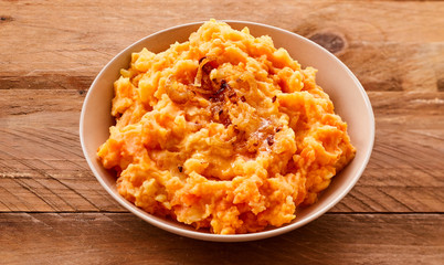Mixture of pureed carrot and potato in a bowl