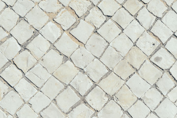 Road or pavement made of natural stone, outdoors background