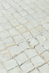 Top view on road or pavement made of natural stone, outdoors background