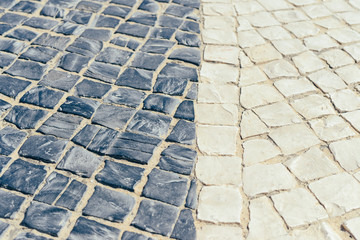 Top view on road or pavement made of natural stone, outdoors background