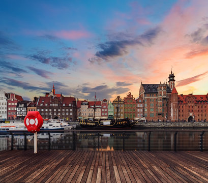 Background with wooden floors and Gdansk cityscape, during sunset. Poland