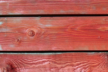 Rot gestrichene Holzdielen als Hintergrund