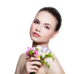 Fototapeta premium Beautiful Model holding Flowers. Spa Beauty, Medicine and Treatment