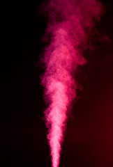 Red vapor on black background