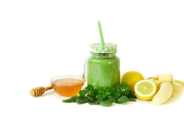 Green vegetable smoothie from spinach, parsley, banana, lemon and honey.