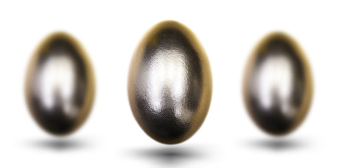 Golden egg for Easter on white background.