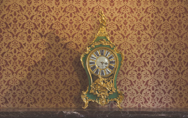 Vintage table clock in a room